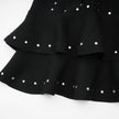 Fabienne -schwarzes, mit Kristallen verziertes, gerafftes Strick-Minikleid